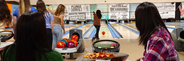 young people bowling