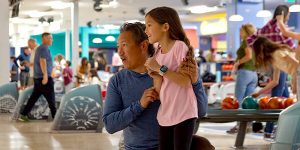 Father and daughter bowling