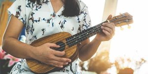 woman playing ukulele